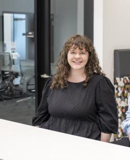 Portrait of Jessica Budwitz in conference room