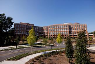 Exterior picture of the iSTEM research complex as seen from East Campus Road