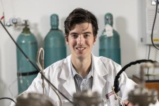 Photo of Nicholas Dewey, DOE Award Winner, in a lab setting