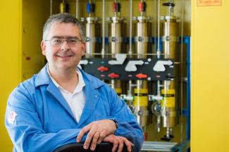 Photo of the speaker, Prof. László Kürti, in an organic chemistry lab setting