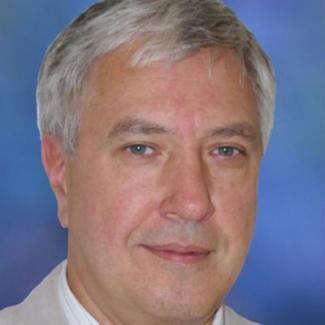 image depicts Dr. Sergiy Minko, caucasian male with short gray hair and blue eyes