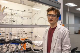 Picture of Skyler Hollers, speaker, in a lab setting