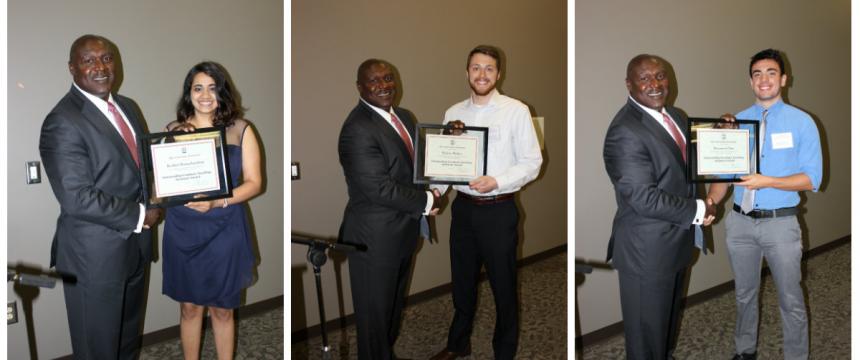 Three of the four award-winning graduate students--  Roshini Ramachandran, Hunter Hickox, and Benjamin Cline-- stand with Chemistry Professor Gregory Robinson