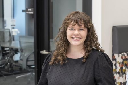 Portrait of Jessica Budwitz in conference room