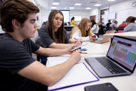 Students working on chemistry problems in an Active Learning classroom setting