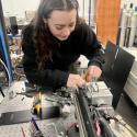 Image of Anna Batchelor, speaker, in a physical chemistry lab setting