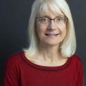 Headshot of Prof. Jennifer Brodbelt, guest speaker, woman with blonde hair, wearing glasses and a dark red top