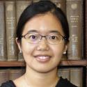 Headshot of Yi Liu, Asian woman with black hair and glasses