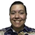 Headshot of Adrian Torres, speaker, man with dark hair and patterned shirt